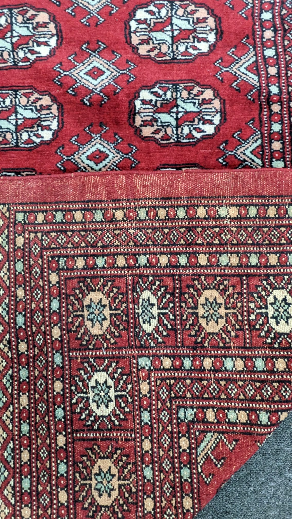 A Bokhara red ground carpet, 280 x 194cm